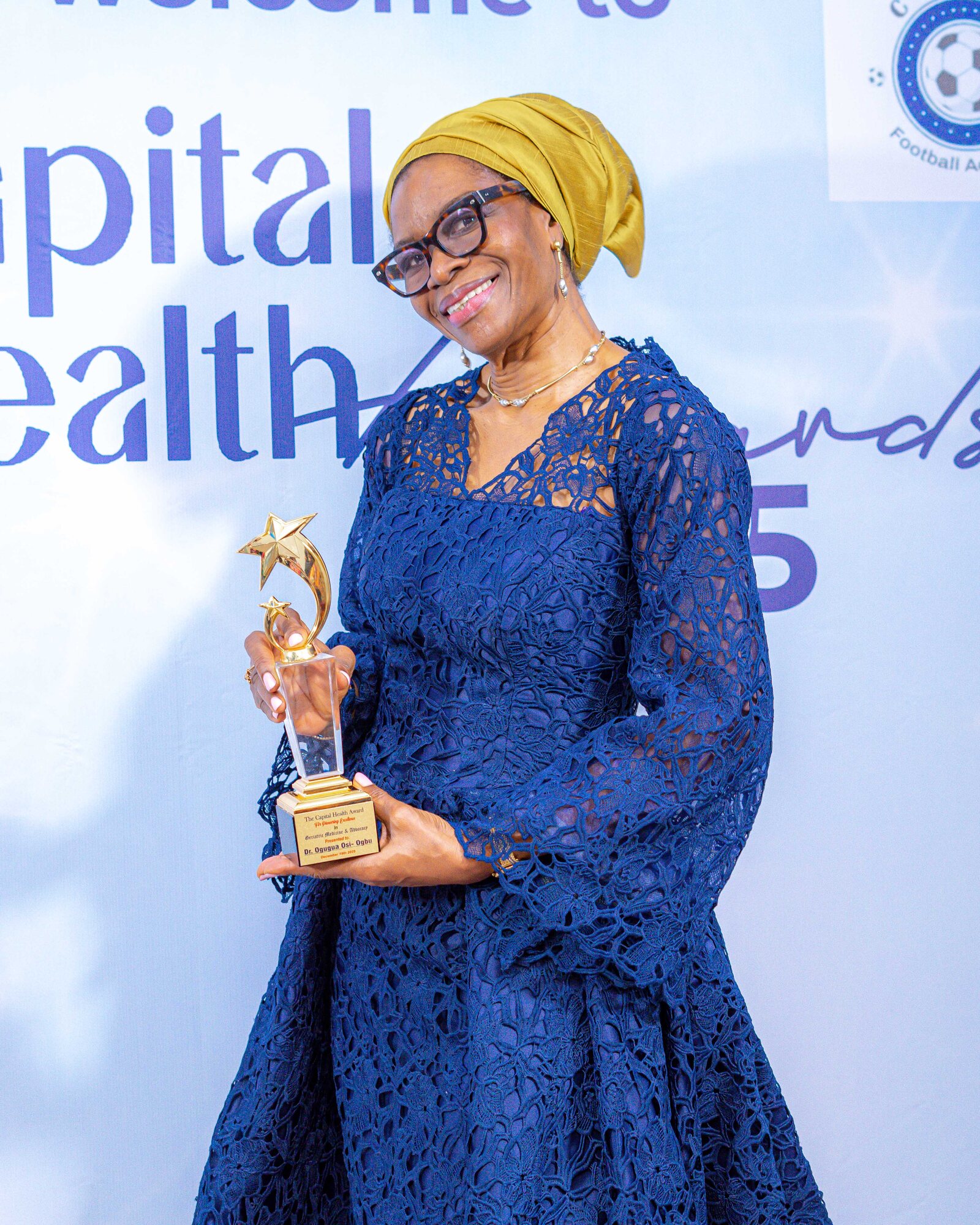 An honouree holding her Capital Health Awards trophy