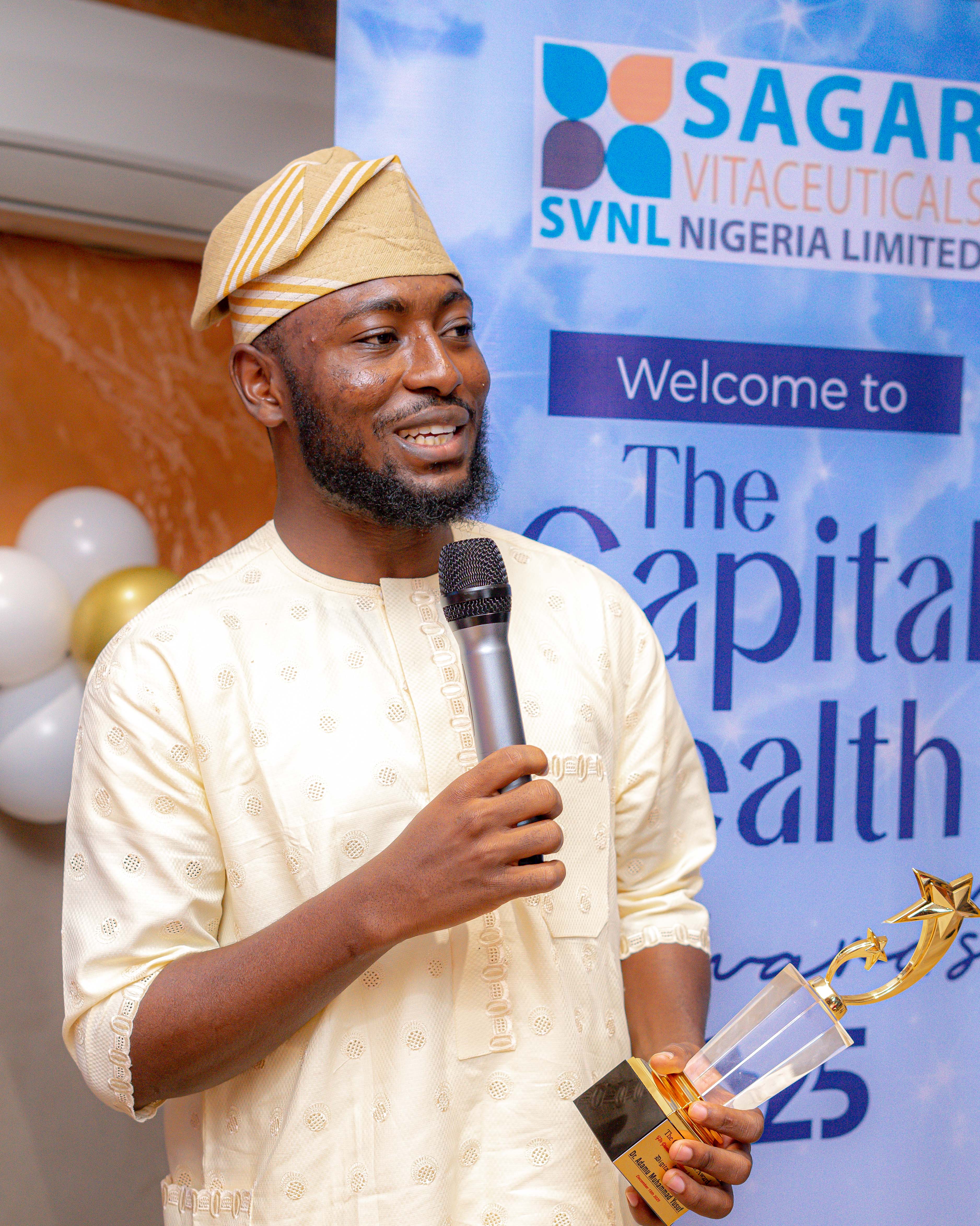 A 2025 Capital Health Awards honouree speaking while holding an award